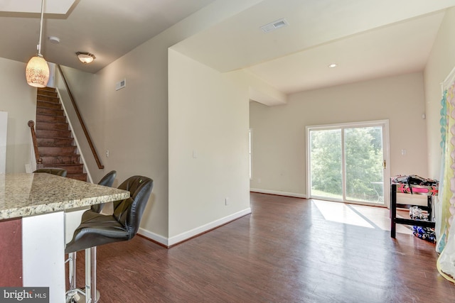 interior space with dark hardwood / wood-style flooring