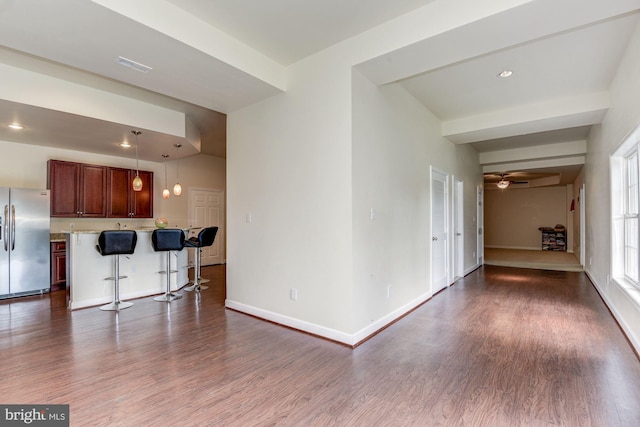 living room featuring hardwood / wood-style floors and ceiling fan