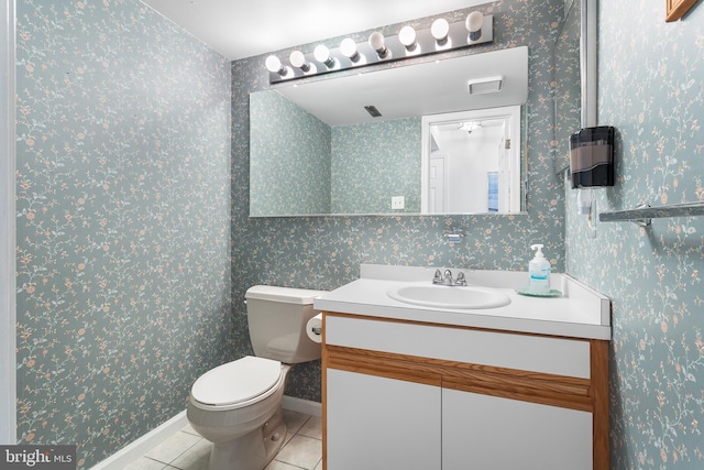 bathroom with tile patterned floors, toilet, and vanity