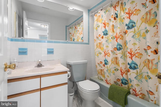 full bathroom featuring tile walls, tile patterned flooring, vanity, shower / tub combo, and toilet