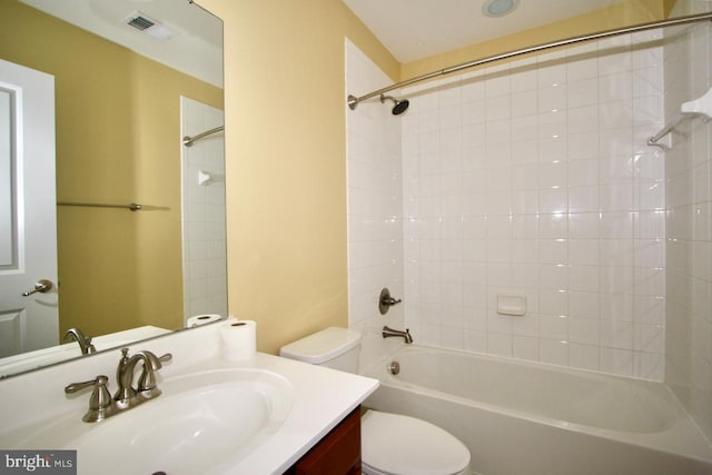 full bathroom with vanity, toilet, and tiled shower / bath