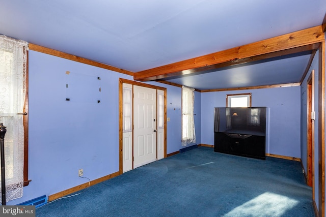 unfurnished living room featuring beam ceiling and dark colored carpet