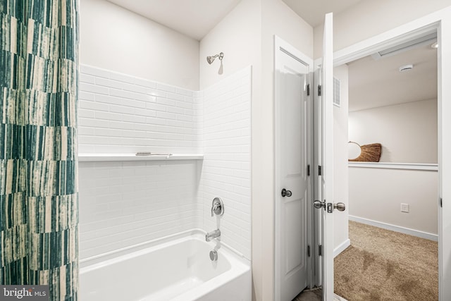 bathroom featuring shower / bathtub combination with curtain