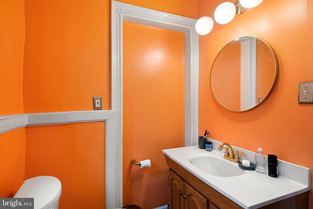 bathroom with vanity and toilet