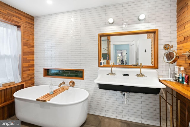 bathroom featuring sink and a tub