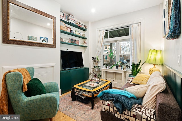 sitting room featuring wood-type flooring