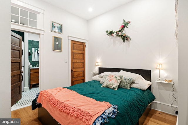 bedroom with hardwood / wood-style floors