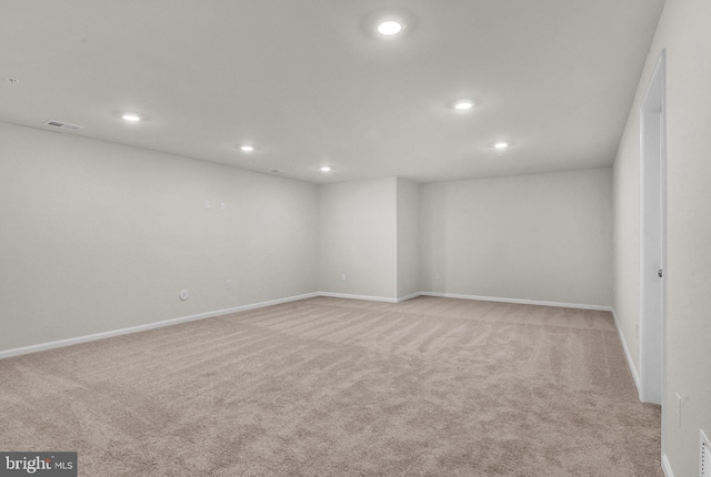 unfurnished room with light carpet