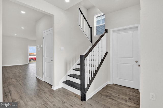 stairway featuring hardwood / wood-style floors