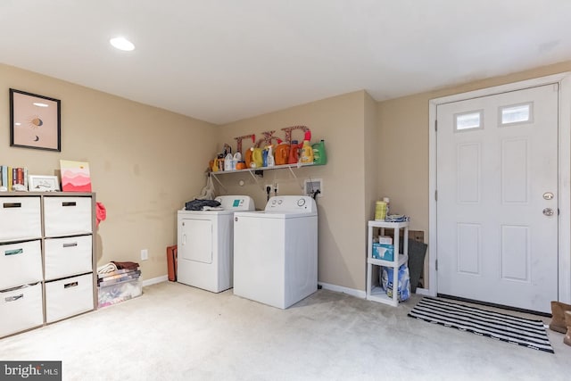 washroom with light colored carpet and separate washer and dryer