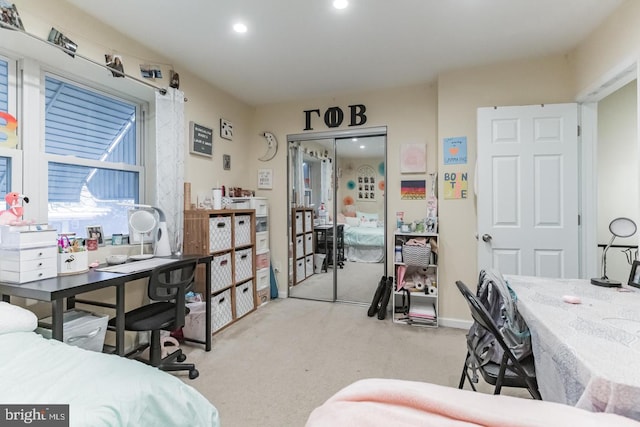 carpeted bedroom with a closet