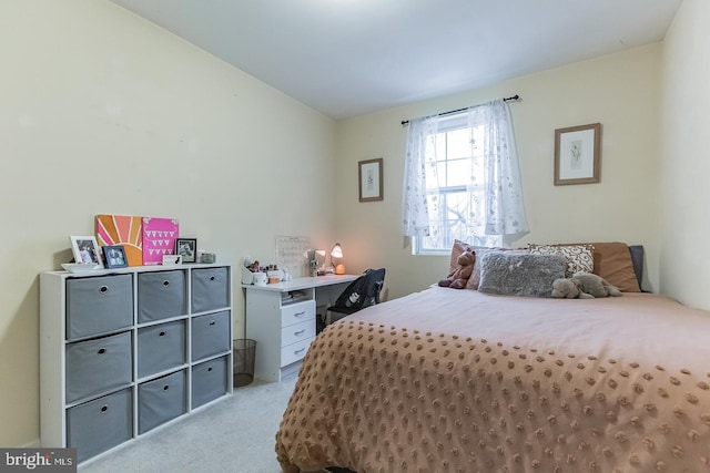 bedroom with light colored carpet