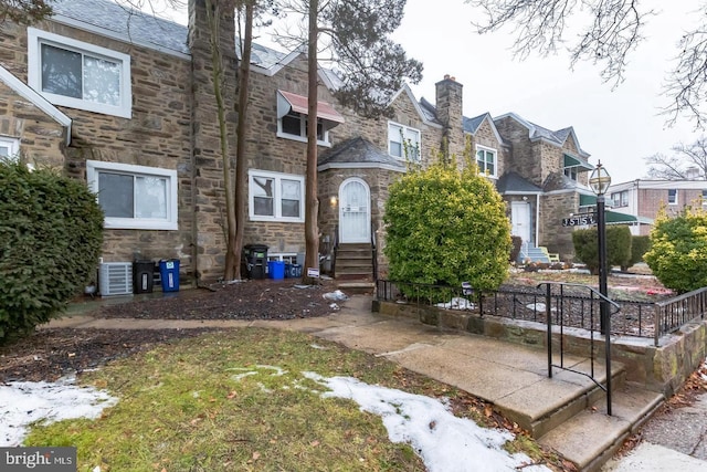 view of front of home with cooling unit