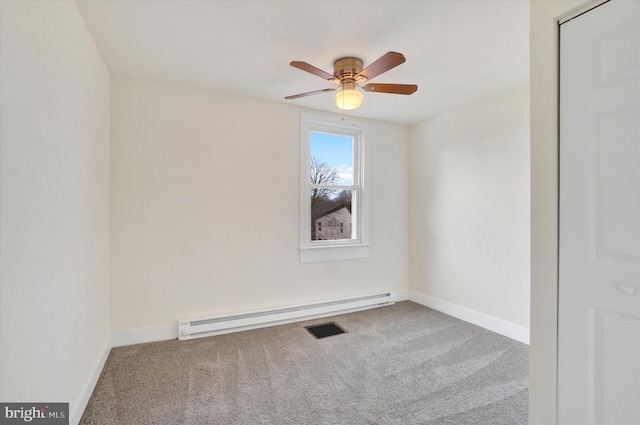 carpeted empty room with a baseboard heating unit and ceiling fan