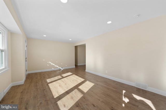 unfurnished room featuring hardwood / wood-style floors