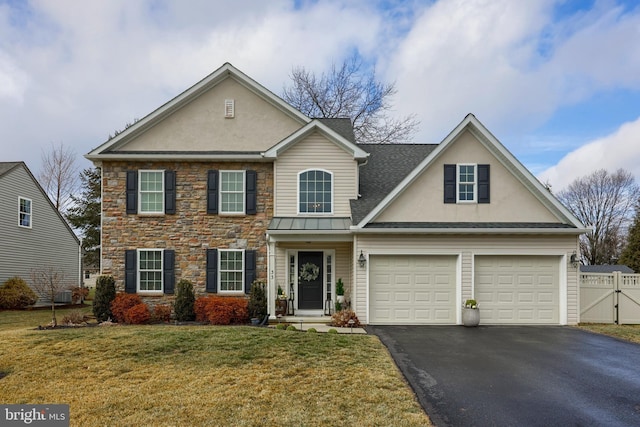 view of front of property with a garage, central AC, and a front lawn