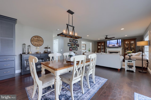 dining space featuring dark hardwood / wood-style floors and ceiling fan