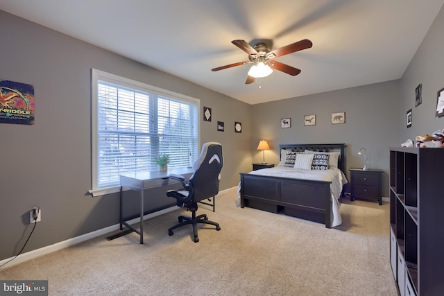 bedroom featuring light colored carpet and ceiling fan