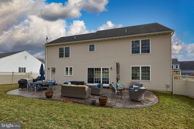 back of property featuring a lawn, outdoor lounge area, and a patio