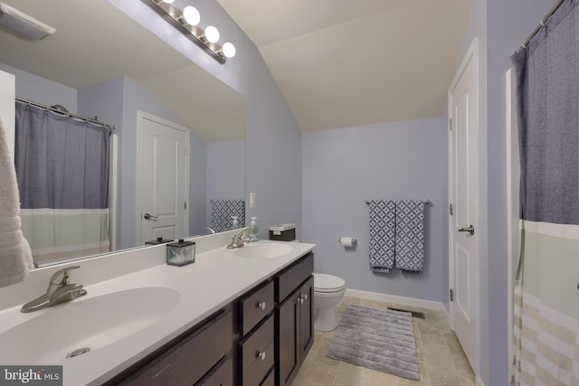 bathroom featuring walk in shower, vanity, toilet, and vaulted ceiling