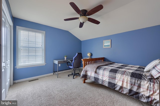 bedroom with lofted ceiling, carpet floors, and ceiling fan