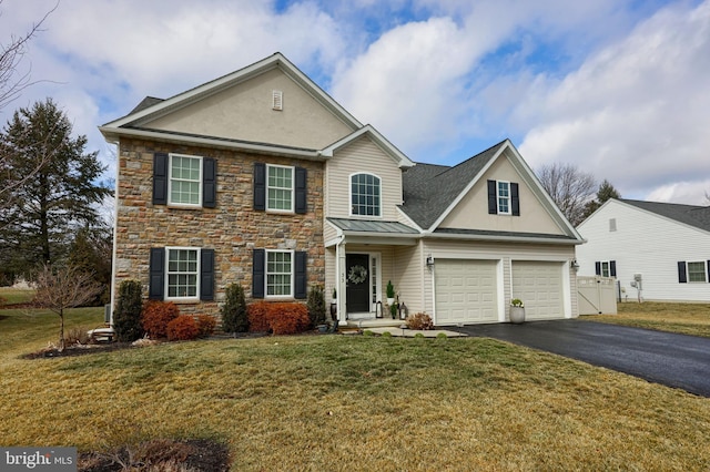 view of front facade with a garage and a front lawn