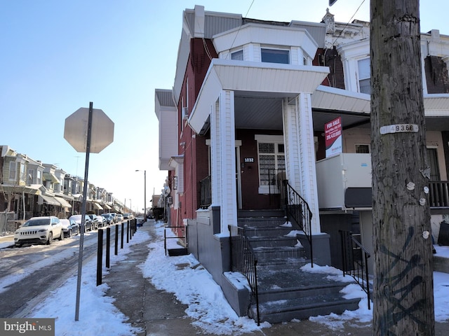 view of snow covered property entrance