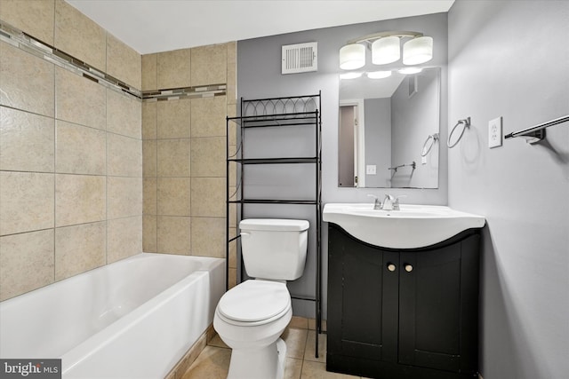 full bathroom with vanity, tiled shower / bath, tile patterned floors, and toilet