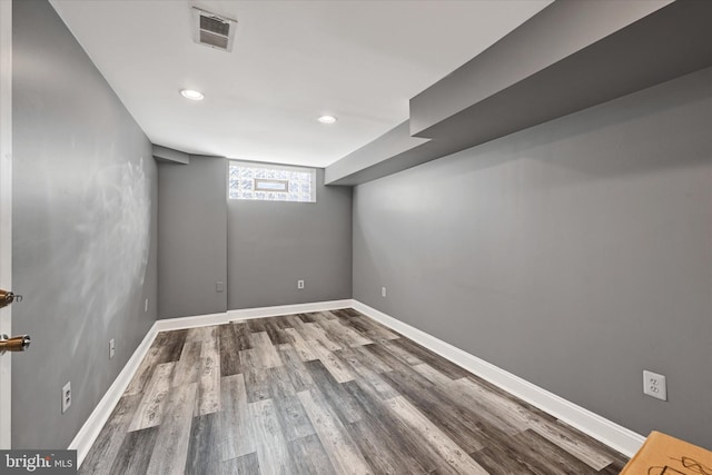 basement featuring wood-type flooring