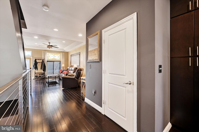 hallway with dark hardwood / wood-style floors