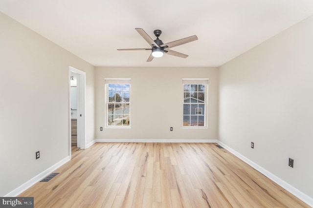 unfurnished room featuring ceiling fan and light wood-type flooring