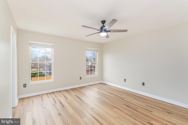 unfurnished room featuring ceiling fan, plenty of natural light, and light hardwood / wood-style floors