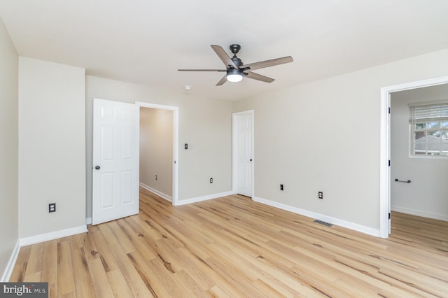 spare room featuring ceiling fan and light hardwood / wood-style flooring