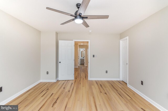 spare room with ceiling fan and light hardwood / wood-style floors