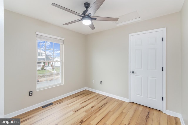 empty room featuring light hardwood / wood-style flooring and ceiling fan