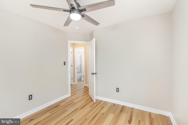 spare room with ceiling fan and light hardwood / wood-style floors