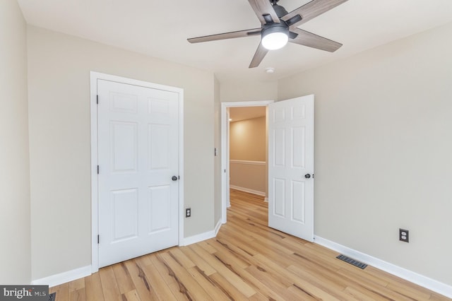 unfurnished bedroom with light hardwood / wood-style floors and ceiling fan