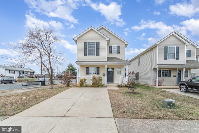 view of front of home featuring a front yard and covered porch