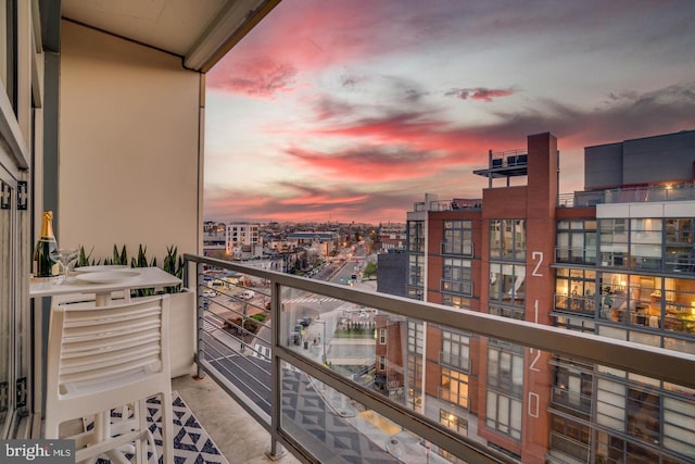 view of balcony at dusk