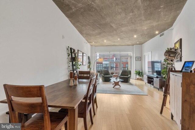 dining space featuring light wood-type flooring