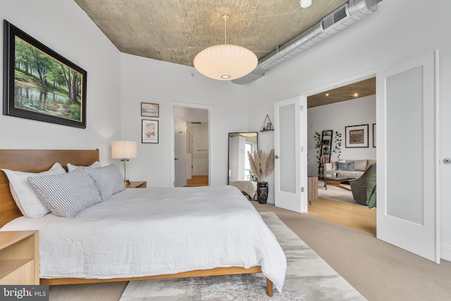 bedroom featuring carpet flooring and french doors