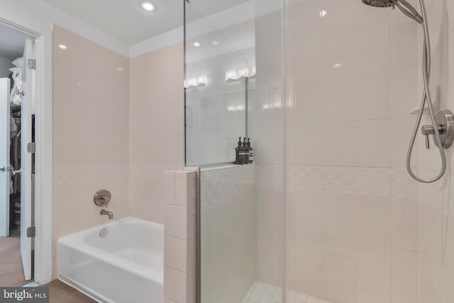 bathroom with shower with separate bathtub