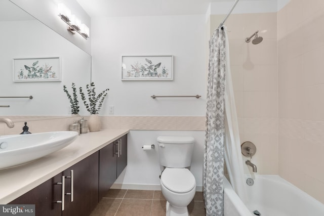 full bathroom featuring vanity, shower / tub combo, tile patterned floors, and toilet