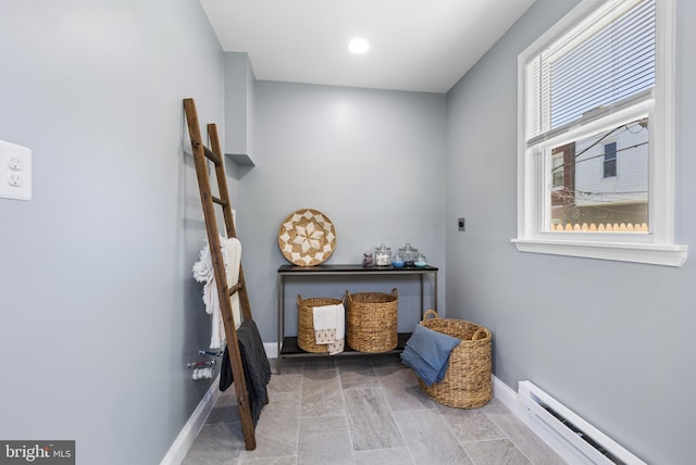 living area with baseboard heating