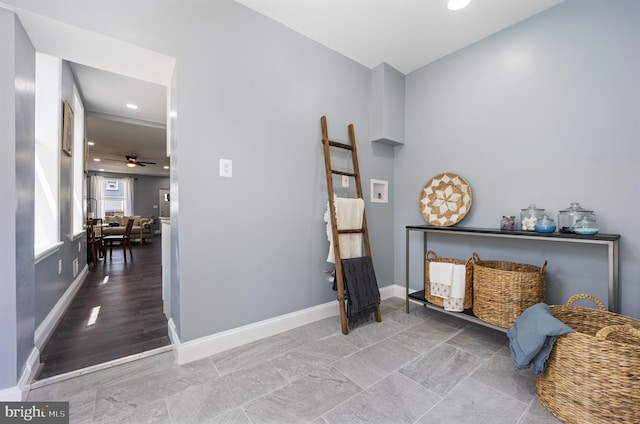 living area with ceiling fan