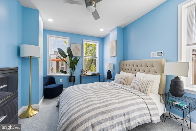 bedroom with ceiling fan and carpet flooring