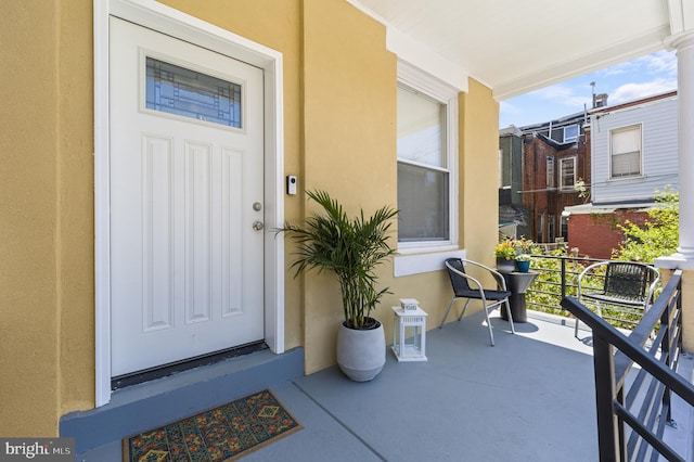 entrance to property featuring a porch