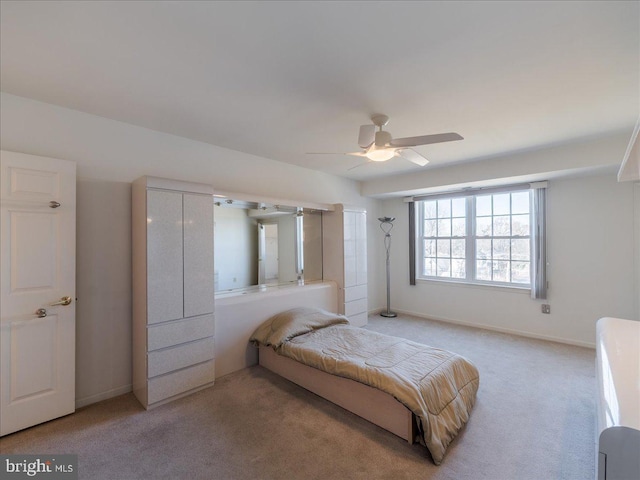 carpeted bedroom with ceiling fan