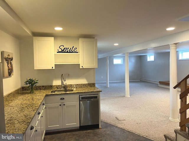 kitchen with a healthy amount of sunlight, sink, dishwasher, and white cabinets