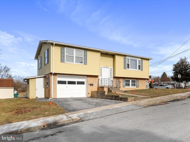 split foyer home featuring a garage